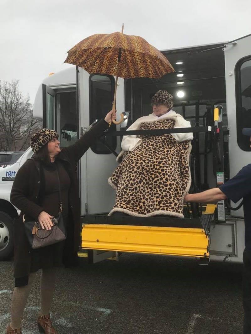 JoAnne Klimovich Harrop (right) holds an umbrella for Evelyn Klimovich on a lunch outing in 2020. (Photo courtesy of Marcellina Hoskow)